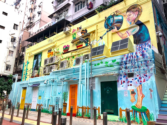 zue chan little girl watering plants mural street art hong kong sai ying pun